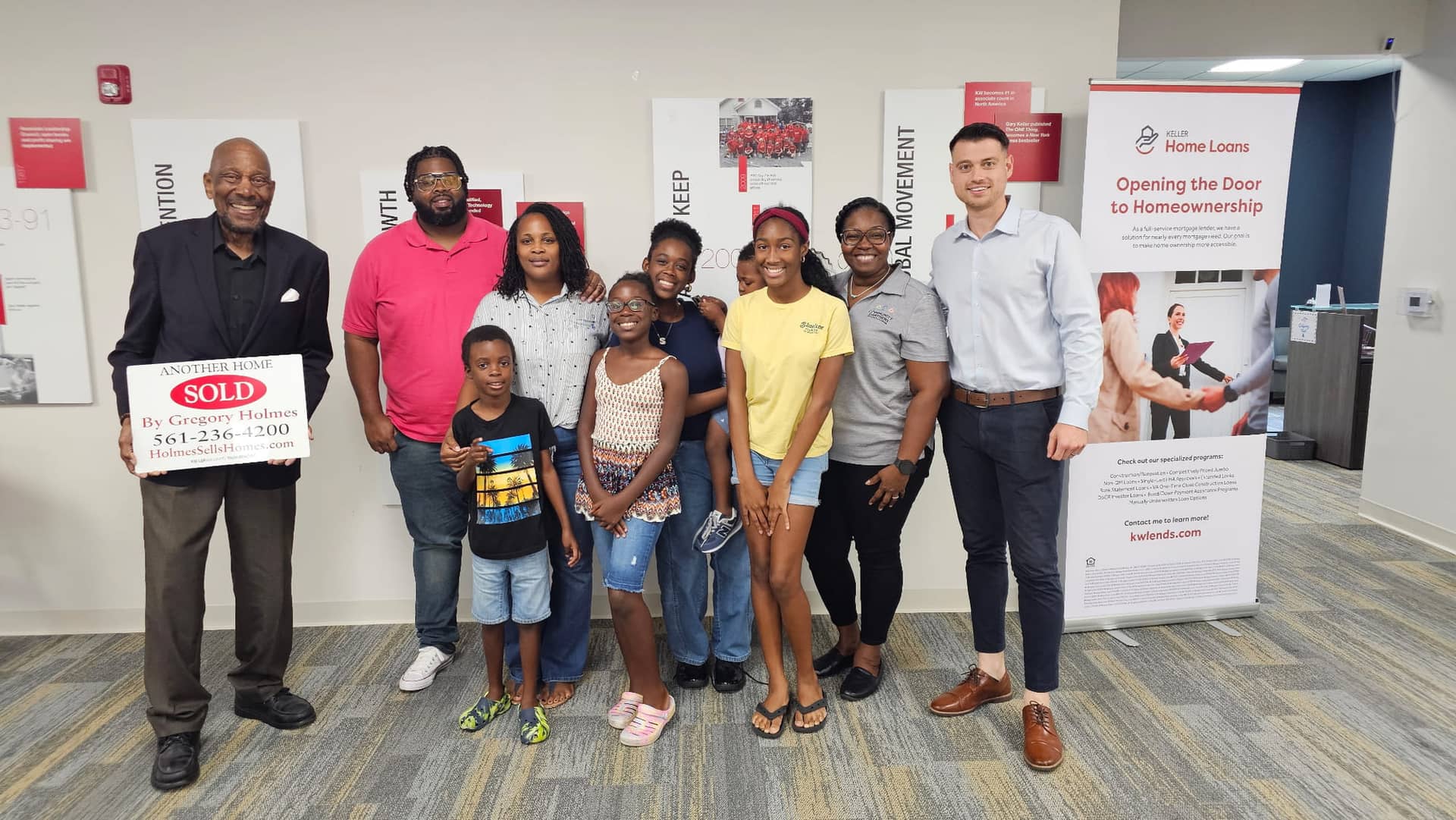 Christopher Molina at a closing with a happy family and realtor partner