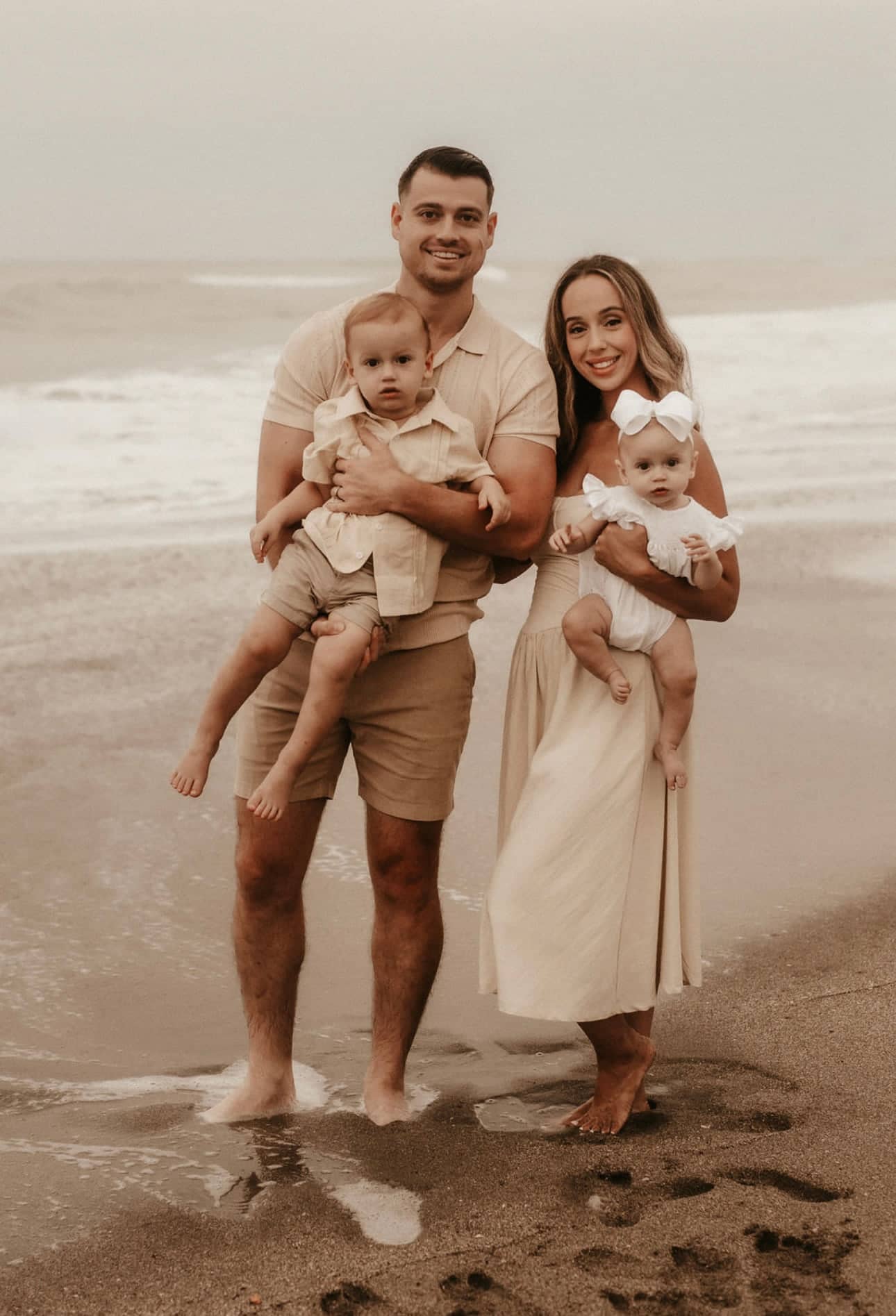 Christopher Molina with his wife and two children on the beach in South Florida